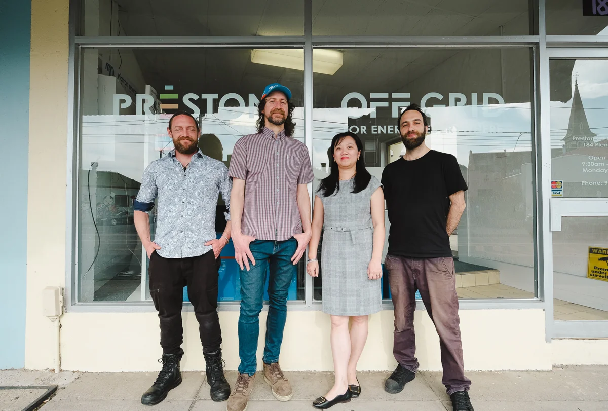 Four Preston Off Grid staff in front of the Preston shopfront